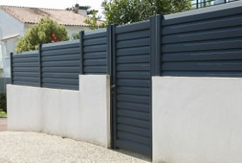 Black coated colorbond fencing an d a matching colorbond gate in a modern residential property in Melville WA.