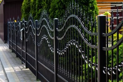 Black painted metal fence in a huge residential property for protection in Melville WA.