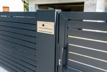 Residential property with a newly installed black-painted automatic sliding gates in Melville WA.